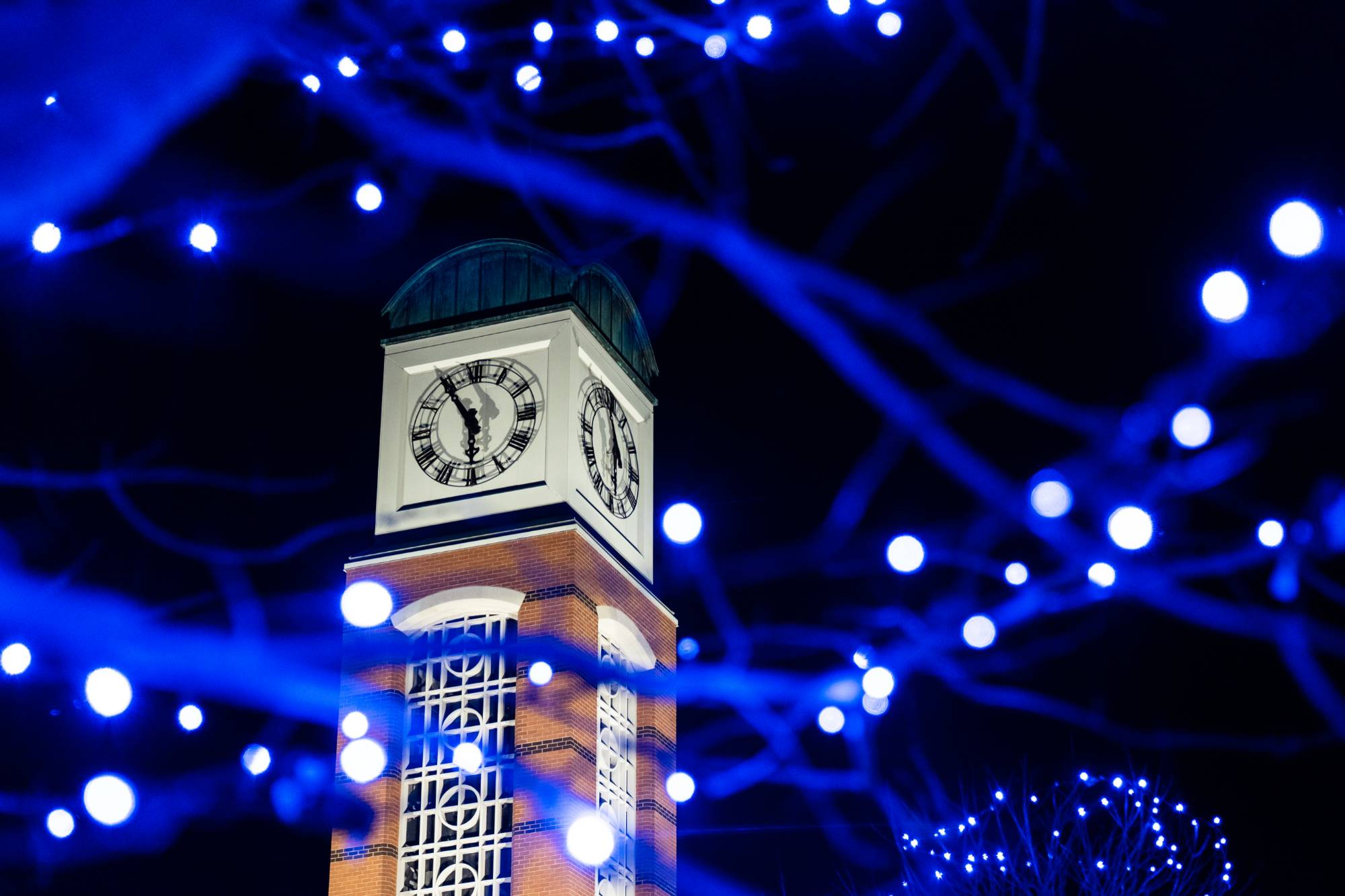 The Cook Carillon Tower surrounded by blue holiday lights